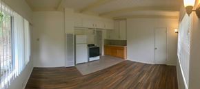 Goleta apartment for rent - A large empty room with wooden floors and white walls.