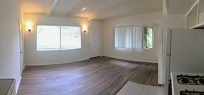 Goleta apartment for rent - A room with a wooden floor and a window with blinds.