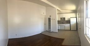 Santa Barbara apartment for rent - A kitchen area with white appliances and a wooden floor.