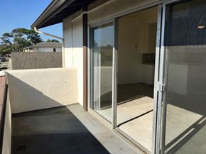 Goleta apartment for rent - A glass door is open to a room with a tiled floor.