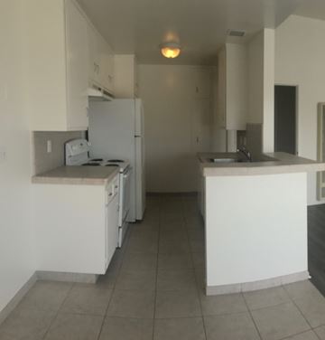 Goleta apartment for rent - A kitchen with white appliances and cabinets.