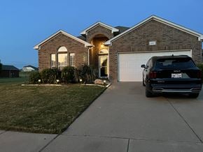 Fort Worth house for rent - a car parked in a driveway in front of a house