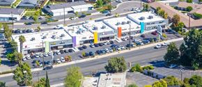 La Habra apartment for rent - an aerial view of a shopping center with cars parked in a parking lot