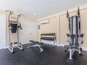 Palm Springs apartment for rent - a home gym with weights and exercise equipment