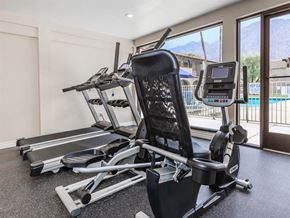 Palm Springs apartment for rent - the gym has a view of the pool