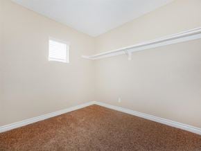 Palm Springs apartment for rent - a bedroom with a carpeted floor and a white closet