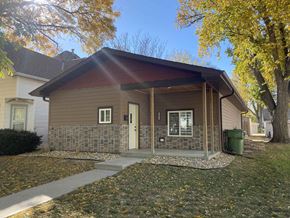 Kearney apartment for rent - the front of a house with a porch and a tree