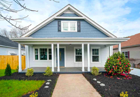 Greenville house for rent - A small house with a porch and a front yard.