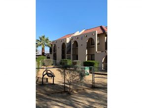 Indio apartment for rent - a building with a playground in front of it