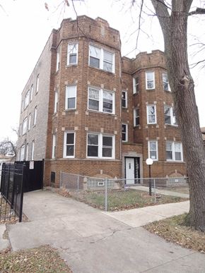 Chicago apartment for rent - a brick building with a sidewalk in front of it