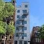 Brooklyn apartment for rent - a tall building with trees in front of it