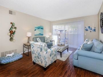 Palm Springs apartment for rent - a living room with furniture and a sliding glass door