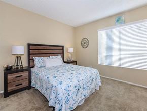 Palm Springs apartment for rent - a bedroom with a bed and a window
