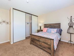 Indio apartment for rent - a bedroom with a bed and a closet