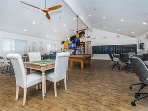 Hemet apartment for rent - a game room with tables and chairs and a pool table
