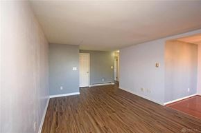 Dayton house for rent - A room with wooden floors and white walls.