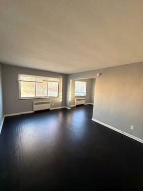 Cincinnati apartment for rent - A room with a window and a radiator on the wall.
