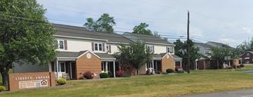 Watsontown apartment for rent - a row of houses with a sign in front of them