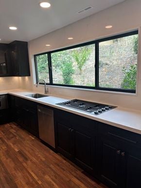 Fairfield house for rent - a kitchen with a stove and a sink and a window