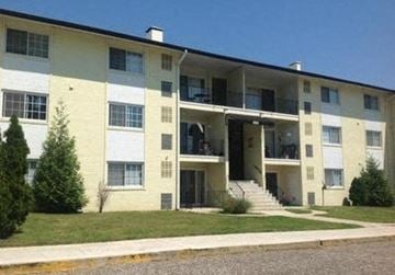 Oxon Hill apartment for rent - an apartment building with stairs and a lawn