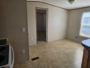Shawnee house for rent - A room with a doorway leading to another room and a window on the right side.