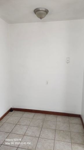 Cincinnati apartment for rent - A white room with a tile floor and a ceiling light.