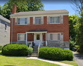Cincinnati apartment for rent - A red brick house with a white door and windows.