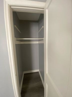 Cincinnati apartment for rent - A white doorway leads to a small pantry with two shelves.