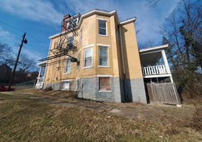 Cincinnati apartment for rent - A two-story building with a yellow and blue exterior.