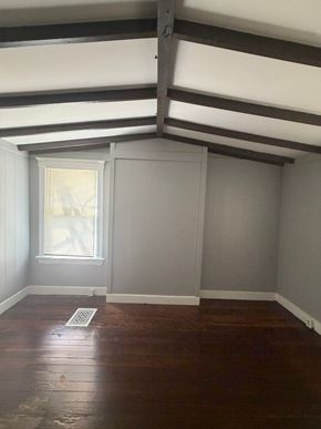 Cincinnati apartment for rent - A room with a window and a wooden floor.