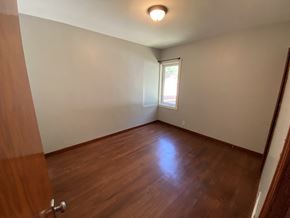 Prince Albert house for rent - a empty room with wooden floors and a window