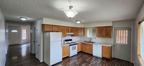 Longview apartment for rent - an empty kitchen with white appliances and wooden cabinets