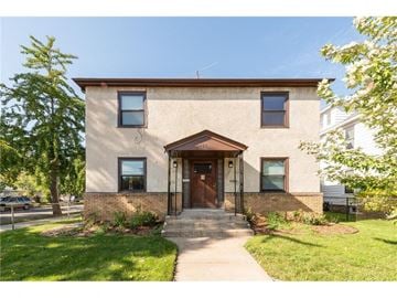 Minneapolis apartment for rent - the front of a brick house with a sidewalk in front of it