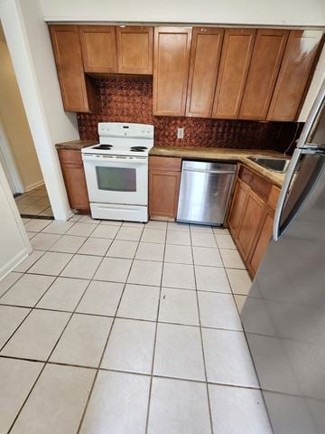 Pensacola house for rent - an empty kitchen with a stove and a refrigerator