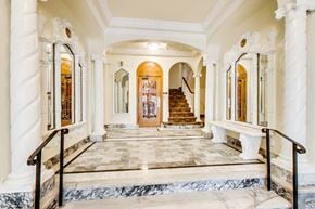 San Francisco apartment for rent - A grand staircase with a marble floor and white columns.