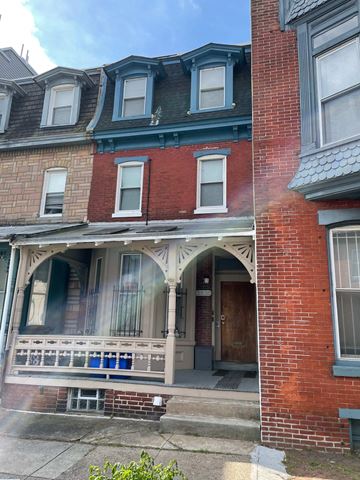 Philadelphia apartment for rent - the front of a brick house with a porch