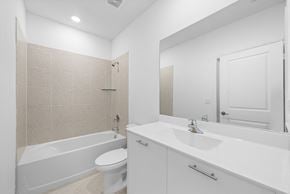Miami apartment for rent - a bathroom with a sink toilet and a tub