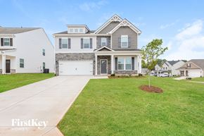 Greenville house for rent - A large house with a garage is shown in the image.