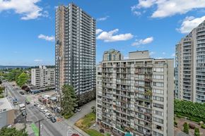 New Westminster apartment for rent - A view of a city street with cars and buildings.