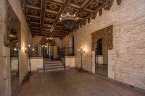 San Francisco apartment for rent - A hallway with a brick floor and a wooden ceiling.
