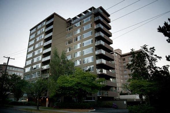 Vancouver apartment for rent - A tall residential building with balconies on the upper floors.