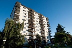 New Westminster apartment for rent - A tall residential building with balconies on each floor.