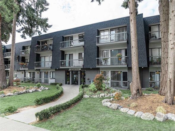 New Westminster apartment for rent - Apartment building with a green lawn in front.