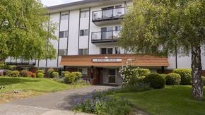 Victoria apartment for rent - A building with a brown awning that says "SETTLE PLACE".