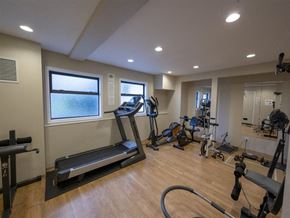 Victoria apartment for rent - A well-equipped gym with treadmills, exercise bikes, and other fitness equipment.