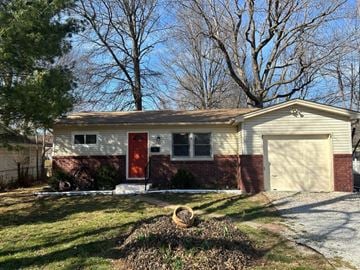 Springfield house for rent - a small white house with a red door and a garage