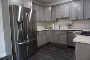 Paterson apartment for rent - a kitchen with stainless steel appliances and white cabinets