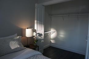 Paterson apartment for rent - a bedroom with a bed and a lamp and a closet
