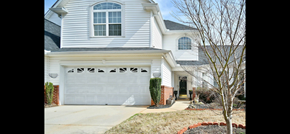 Greer house for rent - a white house with a white garage door