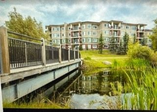 Edmonton apartment for rent - a bridge over a river with buildings in the background